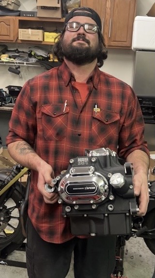 Alex holding a rebuilt 6-speed transmission